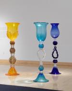 Three life-sized glass goblets.