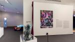 Sculpture of a mermaid in front of Imponderable movie poster.